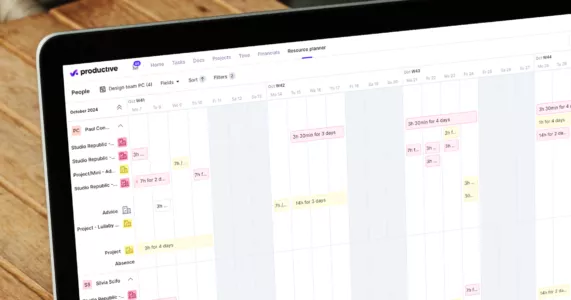 Laptop screen showing a resource planner timeline on Productive